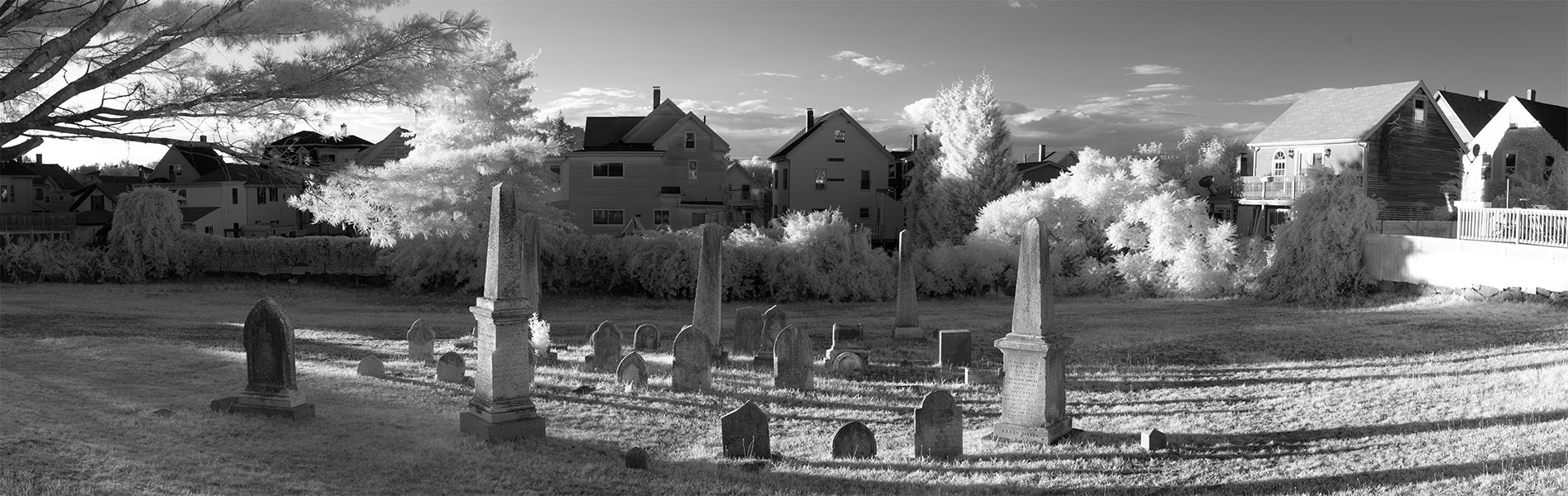 Infrared Panorama of New England Cemetary with Houses in Background.